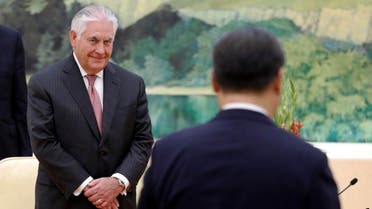 US Secretary of State Rex Tillerson (L) looks at Chinese President Xi Jinping walking to his seat during a meeting at the Great Hall of the People in Beijing on September 30, 2017. Tillerson met with China's foreign minister in Beijing on September 30 to discuss efforts to curb North Korea's nuclear ambitions and prepare President Donald Trump's November visit. (AFP)