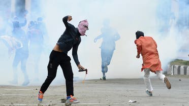 A Kashmiri youth throws a stone during clashes between protesters and Indian government forces in downtown Srinagar on September 2, 2017. afp