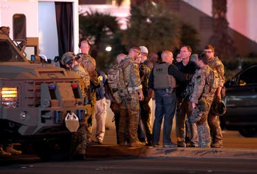 FBI agents confer in front of the Tropicana hotel-casino on October 2, 2017, after a mass shooting during a music festival on the Las Vegas Strip in Las Vegas. (Reuters)