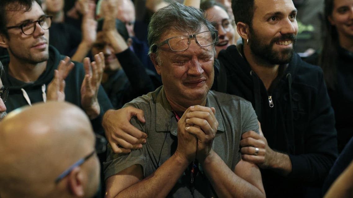 A member of the Catalan National Assembly (ANC) cries at the end of the voting day at the 'Espai Jove La Fontana' (La Fontana youth center) polling station, on October 1, 2017 in Barcelona. (AFP)