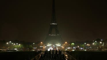 The lights of the Eiffel Tower are switched off on October 2, 2017 in tribute to the victims of the attacks in Las Vegas and Marseille. (AFP)