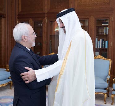 Emir of Qatar Sheikh Tamim bin Hamad al-Thani shakes hands with Iran's Foreign Minister Mohammad Javad Zarif during their meeting in Doha. (Reuters)