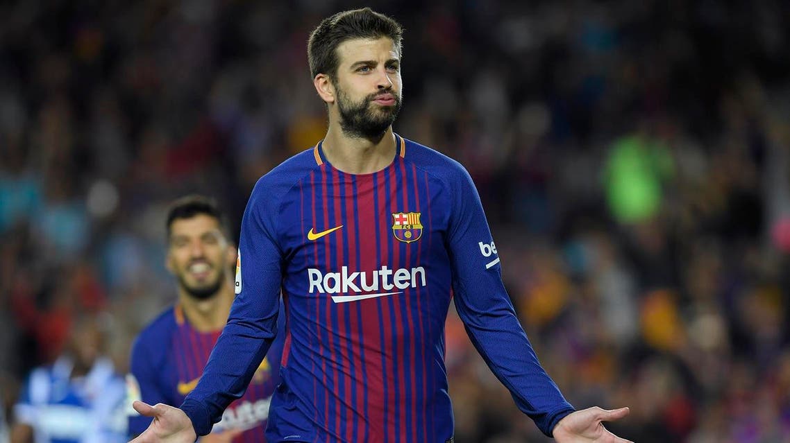 Barcelona's defender Gerard Pique celebrates after scoring during the Spanish Liga football match Barcelona vs Espanyol at the Camp Nou stadium in Barcelona on September 9, 2017. (AFP)