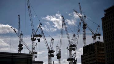 Construction cranes are seen on a building site in central London, Britain, July 31, 2017. REUTERS/Hannah McKay
