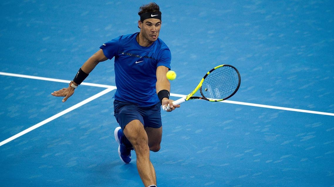 Rafael Nadal of Spain hits a return during his men's singles match against Lucas Pouille of France at the China Open tennis tournament in Beijing on October 3, 2017. (AFP)