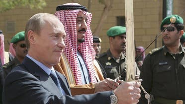 Russian President Vladimir Putin (L) and Prince Salman bin Abdul Aziz, governor of Riyadh and Saudi King’s brother (R) hold swords during a visit to the King Abdul Aziz Historical Centre in Riyadh, 12 February 2007. Russian President Vladimir Putin arrived in Saudi Arabia Sunday on the first leg of a Middle East tour to enhance ties with regional US allies after launching a scathing attack on Washington's "ruinous" foreign policy. AFP PHOTO / ITAR-TASS POOL / PRESIDENTIAL PRESS SERVICE