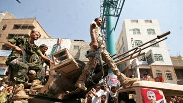 Pro-government troops ride on the back of a military truck as they parade to mark the 55th anniversary of the September 1962 revolution in the war-torn southwestern city of Taiz, Yemen September 26, 2017. (Reuters)