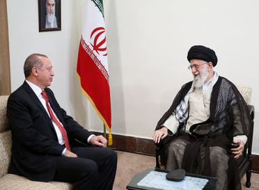 A handout photo provided by the office of Iran's Supreme Leader Ali Khamenei shows him (R) meeting with Turkish President Recep Tayyip Erdogan in Tehran on October 4, 2017. (AFP)