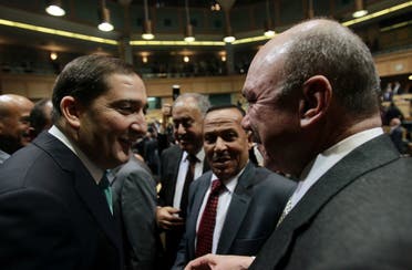 Samir al-Rifai accepts congratulations from President of the House of Representatives Faisal Al Fayez (R) after winning the vote of confidence in the House of Representatives in Amman December 23, 2010. (Reuters)