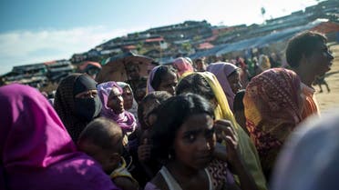 Rohingya Muslim refugees wait line up at a food distribution at Balukhali refugee camp in Bangladesh’s Ukhia district on October 4, 2017. (AFP)