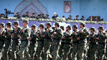 Iran's President Hassan Rouhani, top center, reviews army troops marching during the 37th anniversary of Iraq's 1980 invasion of Iran, in front of the shrine of the late revolutionary founder, Ayatollah Khomeini, just outside Tehran, Iran, Friday, Sept. 22, 2017. AP 