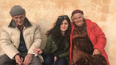 Reine Hanna (C) with an elderly couple in Dashqotani, near Alqosh, in Nineveh Plain. The couple reportedly told her that they are the only members of their respective families who refused to leave Iraq. (Picture supplied)