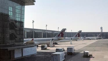 Qatar Airways planes are seen parked at the Hamad International Airport in Doha. (AP)