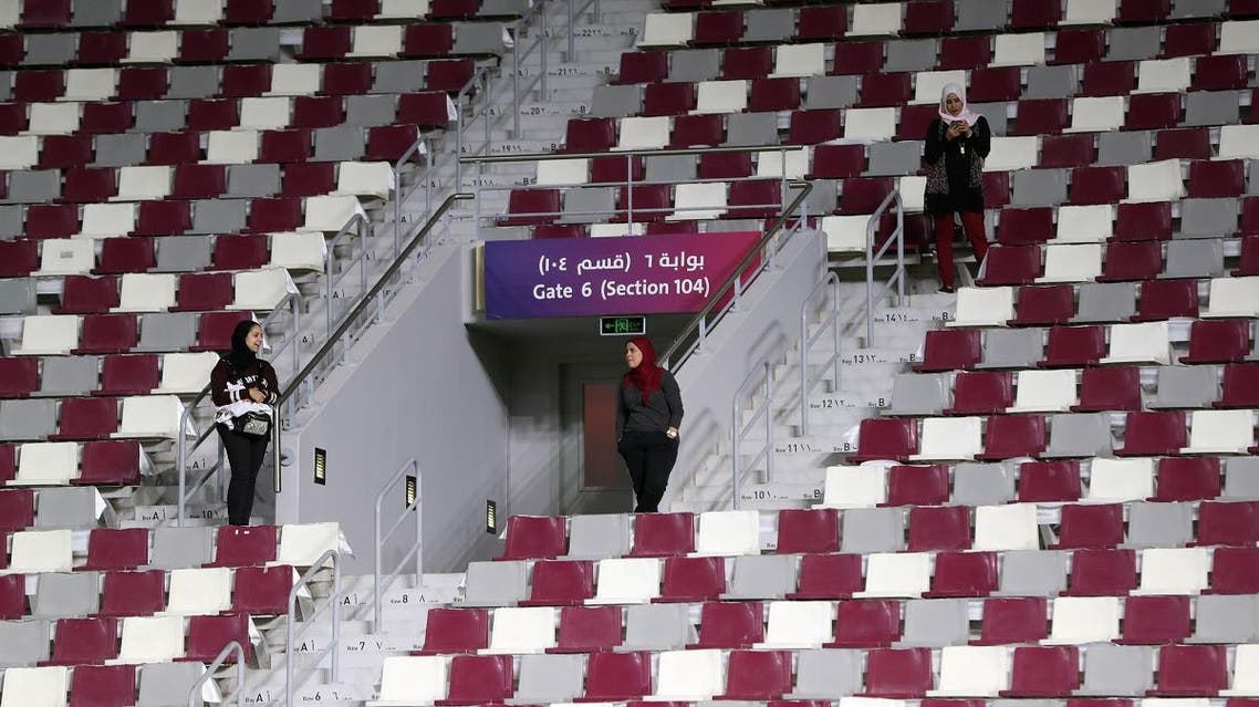 Women stand next to audience seats at the Khalifa International Stadium in Doha, Qatar, May 18, 2017. (Reuters)