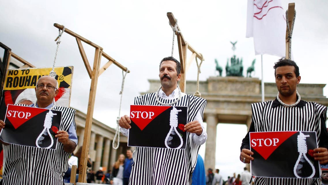 People stage a protest against the recent execution by Iran of up to 20 Kurdish Islamists suspected of attacks on security forces, in front of the Brandenburg gate in Berlin, Germany, August 12, 2016. (Reuters)