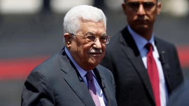 Palestinian President Mahmoud Abbas stands during a reception ceremony for Jordan's King Abdullah II in the West Bank city of Ramallah, August 7, reuters