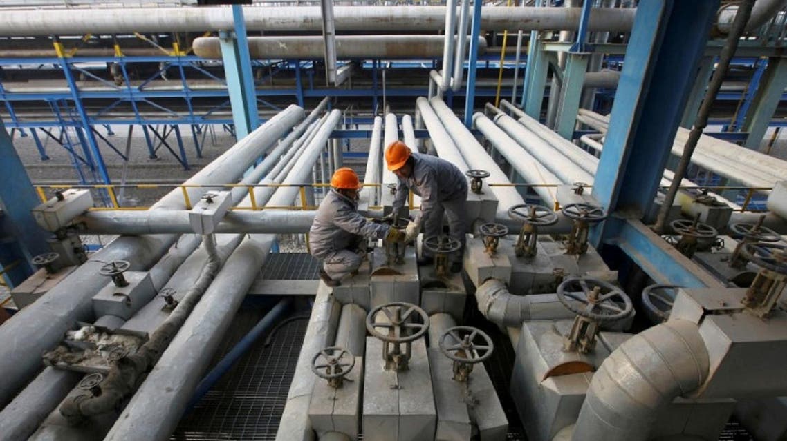 China’s oil refinery workers at work. The country’s oil and gas imports jump in September. (Reuters)
