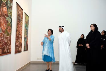 Artist Thuraya Al Baqsami explaining her works during the inauguration of the exhibition to the VIP guests. (Supplied)