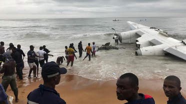 People pull the wreckage of a propeller-engine cargo plane after it crashed in the sea near the international airport in Ivory Coast’s main city, Abidjan, on October 14, 2017. (Reuters)