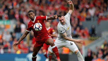 Liverpool’s Georginio Wijnaldum in action with Manchester United’s Phil Jones in the Premier League  match at  Anfield, Liverpool, Britain on October 14, 2017.(Reuters)