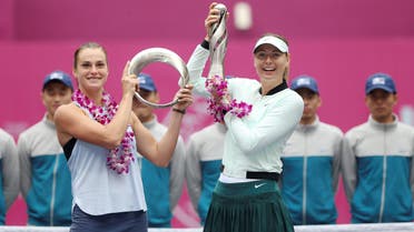 Winner Maria Sharapova of Russia (right) and Aryna Sabalenka of Belarus pose with their trophies after the Tianjin Open Women’s singles final on October 15, 2017. (Reuters)