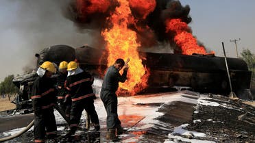 Afghan firefighters attempt to extinguish a burning fuel tanker which was hit by a magnetic bomb on the outskirts of Jalalabad, Afghanistan, on October 16, 2017. (File photo: Reuters)