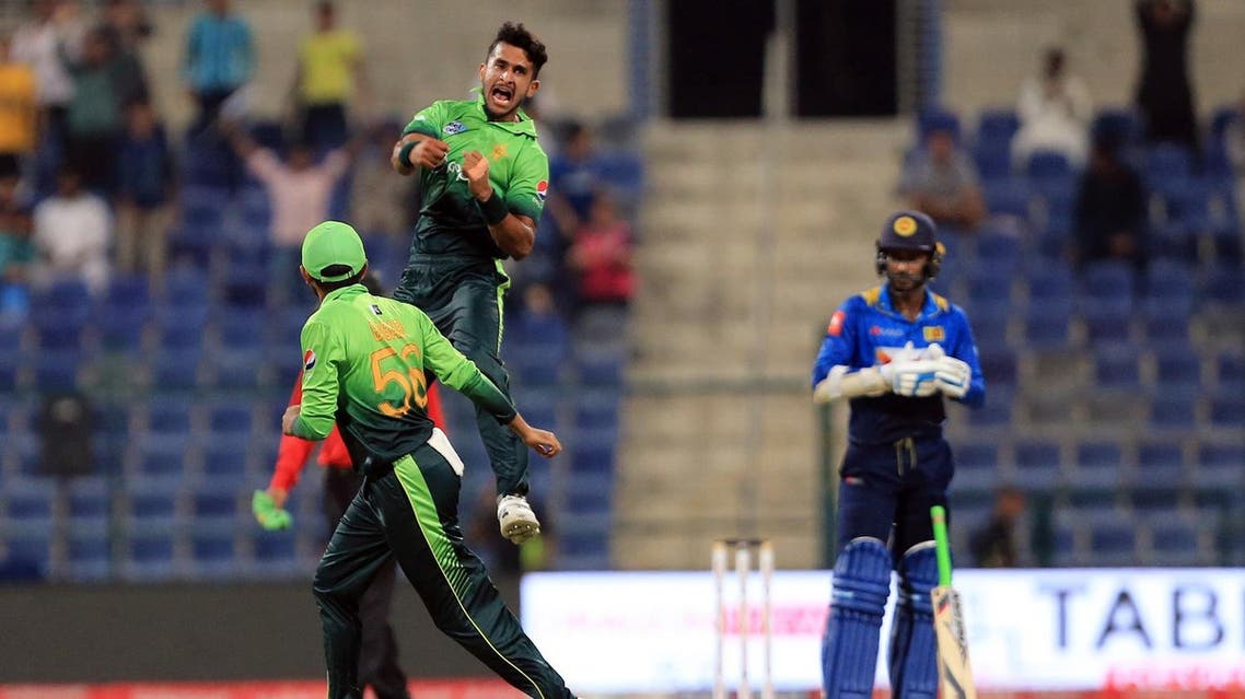 Pakistan's (C) Hassan Ali celebrates after dismissing Sri Lanka's Kusal Mendis during the second one day international (ODI) cricket match between Sri Lanka and Pakistan at Sheikh Zayed Stadium in Abu Dhabi on October 16, 2017. NEZAR BALOUT / AFP