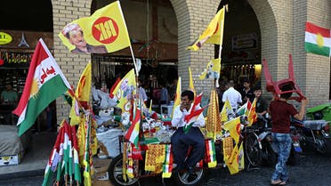 A street vendor sells Kurdish flags and pro-independence items in central Irbil, 217 miles (350 kilometers) north of Baghdad, Iraq, Sunday, Sept. 24, 2017. AP