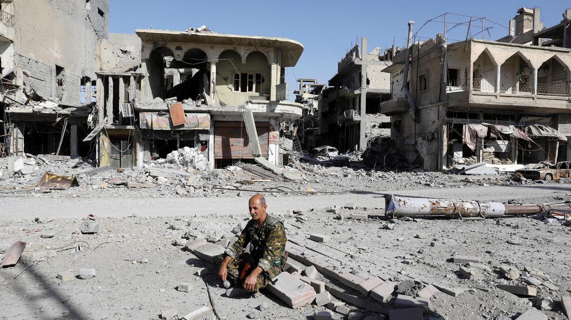A fighter of Syrian Democratic Forces rests on rubble after Raqqa was liberated, in Raqqa, Syria, October 17, 2017. (Reuters)