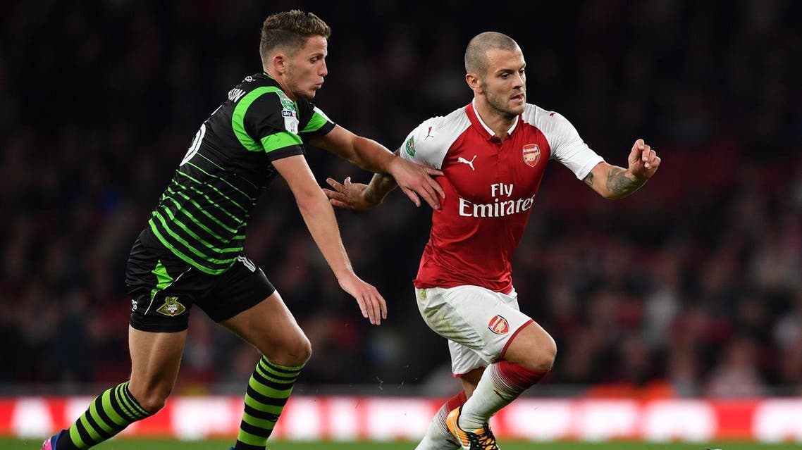 Doncaster Rovers' English midfielder Jordan Houghton (L) vies with Arsenal's English midfielder Jack Wilshere during the English League Cup third round football match between Arsenal and Doncaster Rovers at The Emirates Stadium in London on September 20, 2017. (AFP)