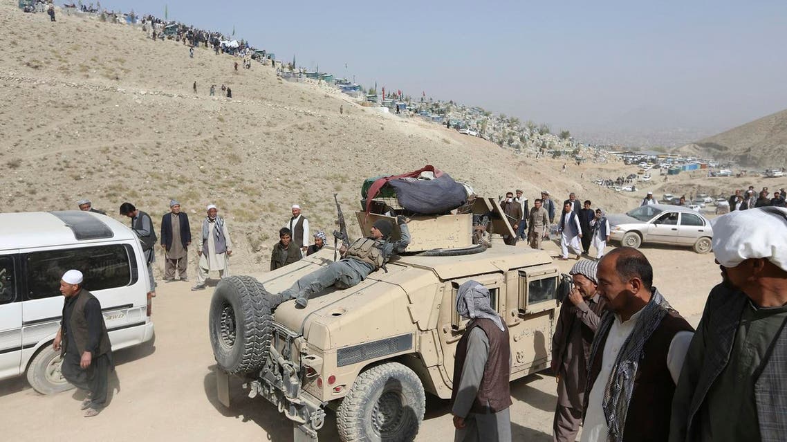Afghan security police patrol near the cemetery, where victim of Friday’s suicide attack at the Shiite mosque were buried, in Kabul, on October 21, 2017. (AP)