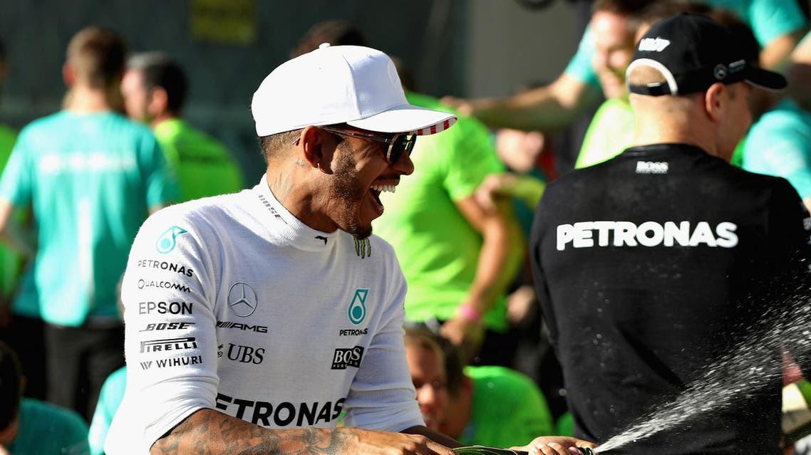 AUSTIN, TX - OCTOBER 22: Race winner Lewis Hamilton of Great Britain and Mercedes GP celebrates with his team after the United States Formula One Grand Prix at Circuit of The Americas on October 22, 2017 in Austin, Texas. Mark Thompson/Getty Images/AFP AUSTIN, TX - OCTOBER 22: Race winner Lewis Hamilton of Great Britain and Mercedes GP celebrates with his team after the United States Formula One Grand Prix at Circuit of The Americas on October 22, 2017 in Austin, Texas. Mark Thompson/Getty Images/AFP