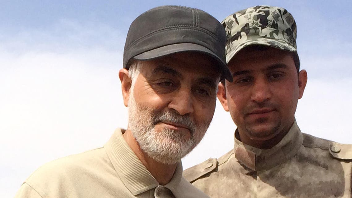 FILE PHOTO: Iranian Revolutionary Guard Commander Qassem Soleimani (L) stands at the frontline during offensive operations against Islamic State militants in the town of Tal Ksaiba in Salahuddin province March 8, 2015. (Reuters)