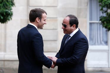 French President Emmanuel Macron, left, welcomes Egyptian President Abdel-Fattah el-Sissi in the courtyard of the Elysee Palace in Paris, Tuesday Oct. 24, 2017. (AP)