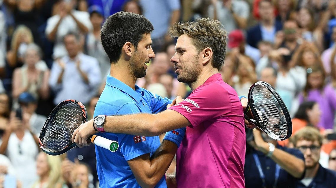 Stan Wawrinka of Switzerland embraces Novak Djokovic (L) of Serbia at the end of their 2016 US Open Men's Singles final match at the USTA Billie Jean King National Tennis Center in New York on September 11, 2016. Stan Wawrinka became the oldest US Open men's champion in 46 years when he defeated world number one Novak Djokovic to claim a third Grand Slam title on Sunday. (AFP)
