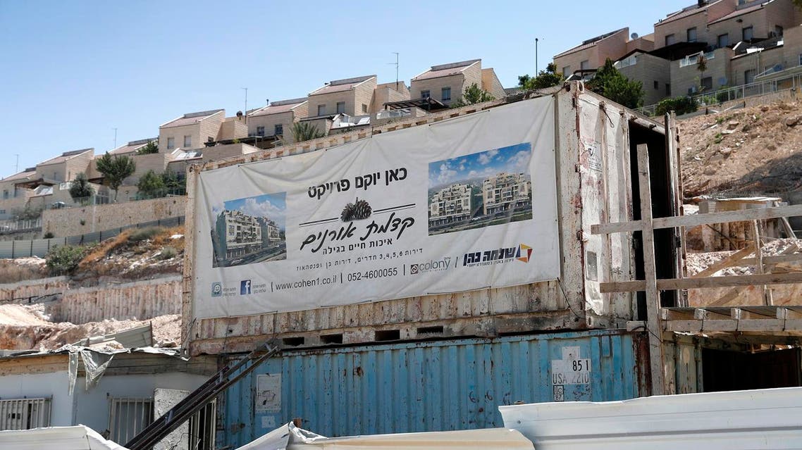 A general view taken on July 4, 2017 shows a poster advertising a new construction project in the Israeli settlement of west Gilo on the outskirts of Jerusalem. (AFP)
