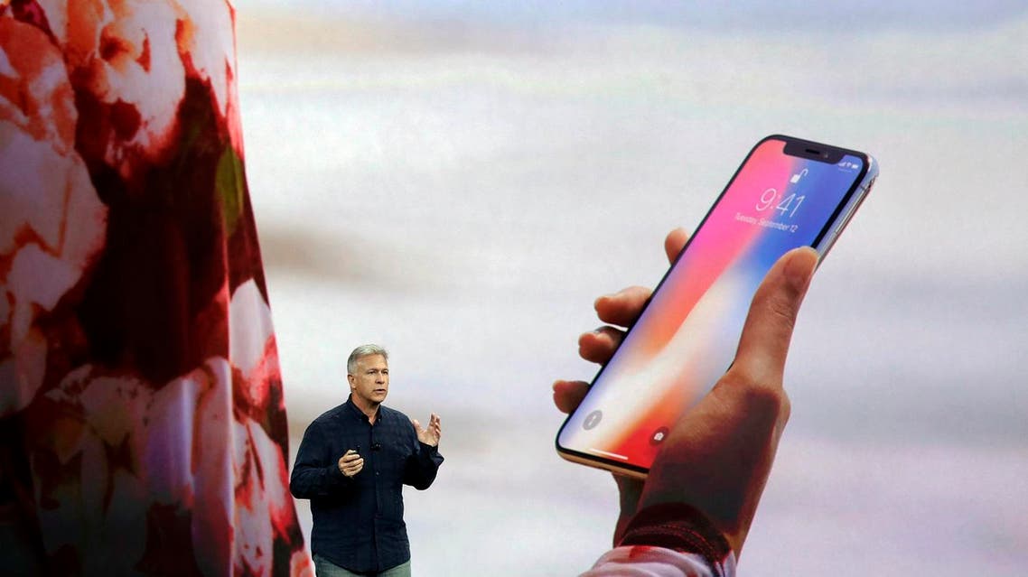FILE - In this Tuesday, Sept. 12, 2017, file photo, Phil Schiller, Apple's senior vice president of worldwide marketing, announces features of the new iPhone X, including Face ID, at the Steve Jobs Theater on the new Apple campus, in Cupertino, Calif. Apple's new Face ID facial recognition system is due to debut with the iPhone X on Nov. 3. The system lets users unlock their phones just by glancing at them, but have also raised privacy questions and some anxieties over the ease with which others unlock a user’s phone. (AP Photo/Marcio Jose Sanchez, File)