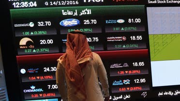 A Saudi investor monitors the stock exchange at the Saudi Stock Exchange, or Tadawul, on December 14, 2016 in the capital Riyadh. FAYEZ NURELDINE / AFP
