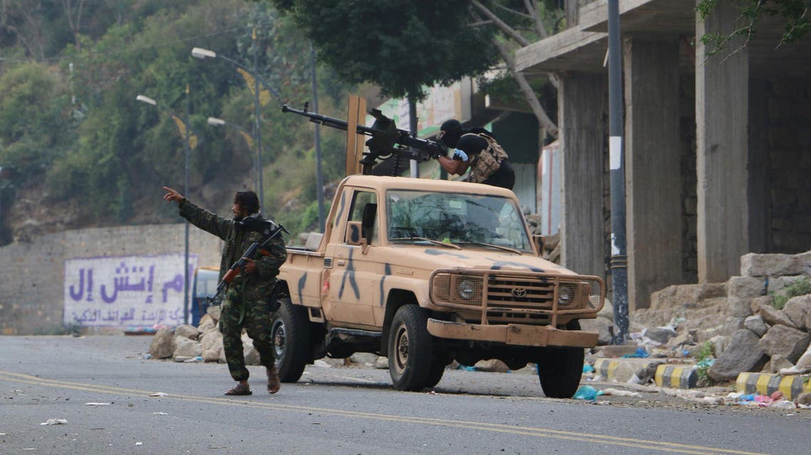 Tribal fighters take position on a street during fighting with Shiite rebels known as Houthis, in Taiz, Yemen, Tuesday, Dec. 15, 2015. (AP)
