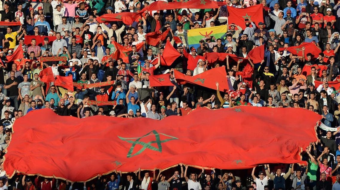 Maroccan supporters hold flags during the 2017 Africa Cup of Nations qualifying football match against Libya in Agadir on June 12, 2015. (File photo: AFP)