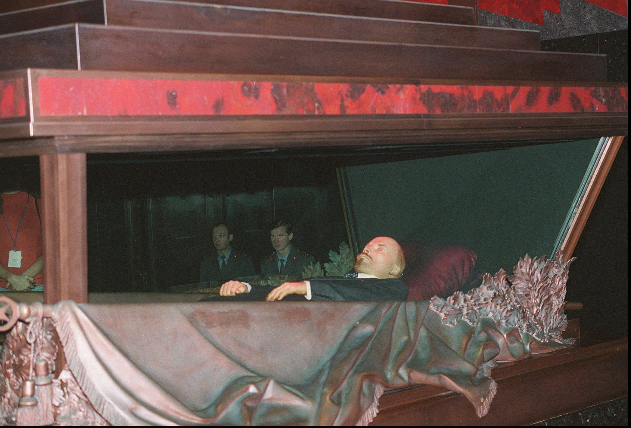 Mummified body of the Soviet Union founder Vladimir Lenin lies behind the glass in the granite-and-marble mausoleum outside the Kremlin wall in Moscow, November 30, 1994. (AP)