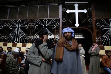 Men mourn over the Egyptian Coptic Christians who were captured in Libya and killed by militants affiliated with ISIS, at the Virgin Mary church in the village of el-Aour, near Minya. (File photo: AP)