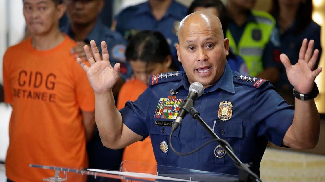 Philippine National Police Chief Director General Ronald Dela Rosa, right, gestures as he talks to reporters at police headquarters in metropolitan Manila, Philippines on Tuesday, Oct. 24, 2017. (AP)