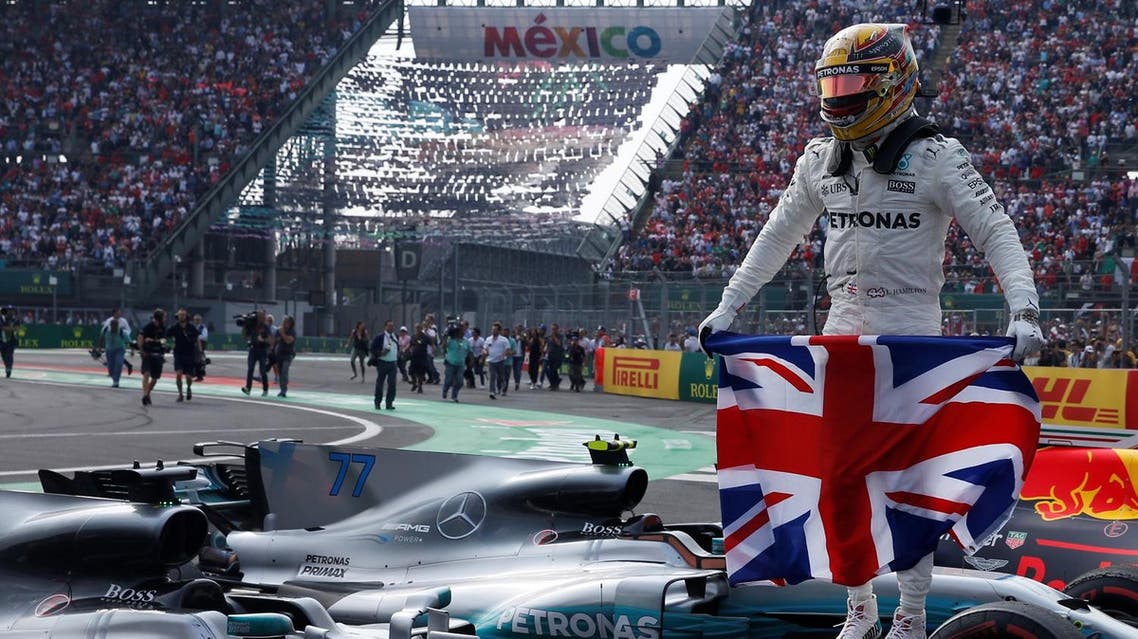 F1 - Formula 1 - Mexican Grand Prix 2017 - Mexico City, Mexico - October 29, 2017 Mercedes' Lewis Hamilton celebrates after winning the World Championship REUTERS/Henry Romero