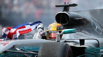 Hamilton takes fourth title despite collision