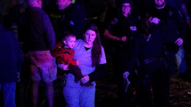 A woman with her child during the shooting in Thornton, Colorado November 1, 2017. (Reuters)