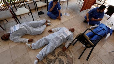 Syrian medical staff take part in a training exercise to learn how to treat victims of chemical attacks in Gaziantep, Turkey, on July 20, 2017. (Reuters)