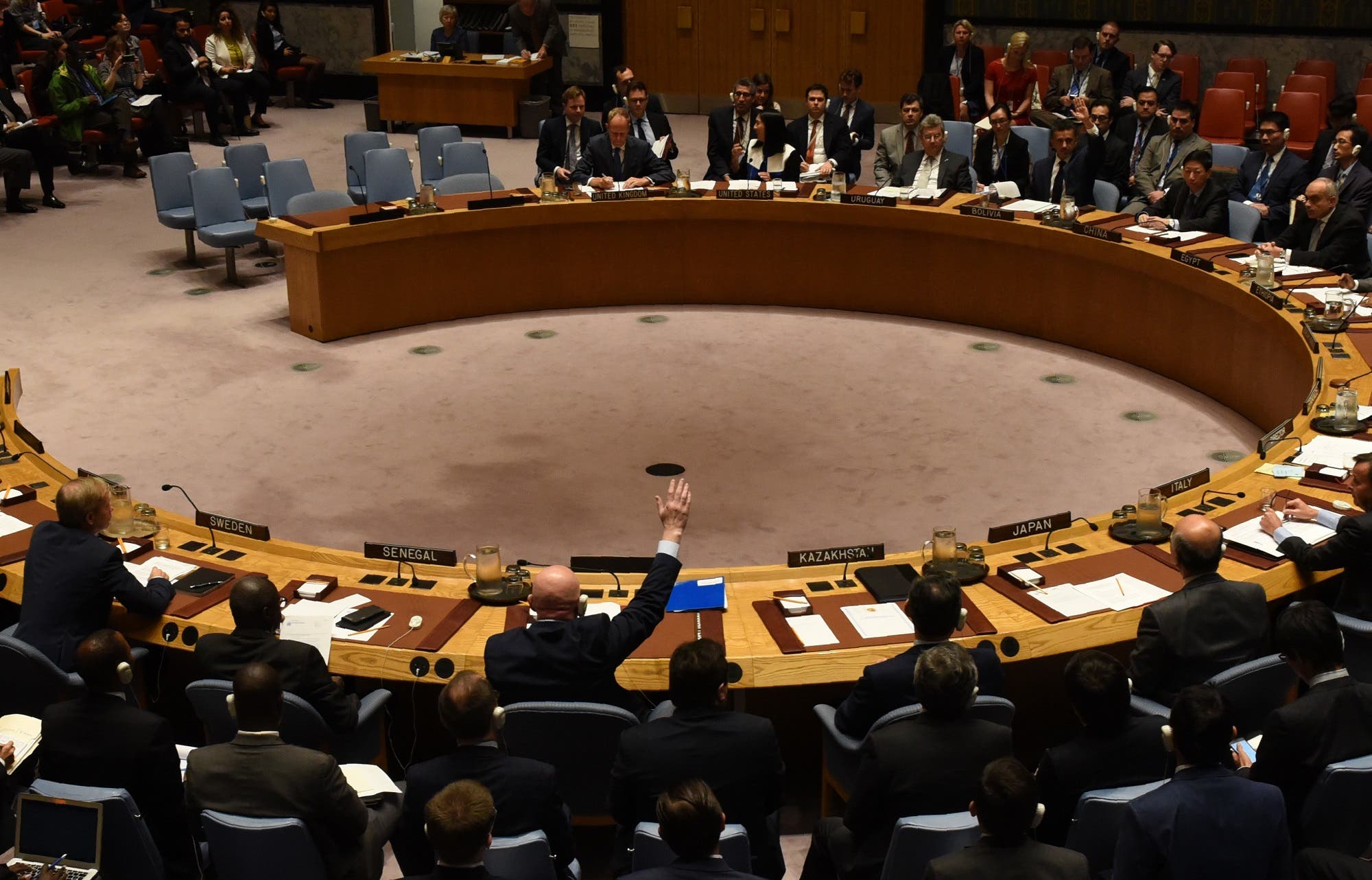 Security Council votes to extend probe into who is responsible for chemical weapons attacks in Syria at the UN on October 24, 2017. Russian Ambassador to the UN Vassily Nebenzia (raising his hand) voted no to the resolution. (AFP)