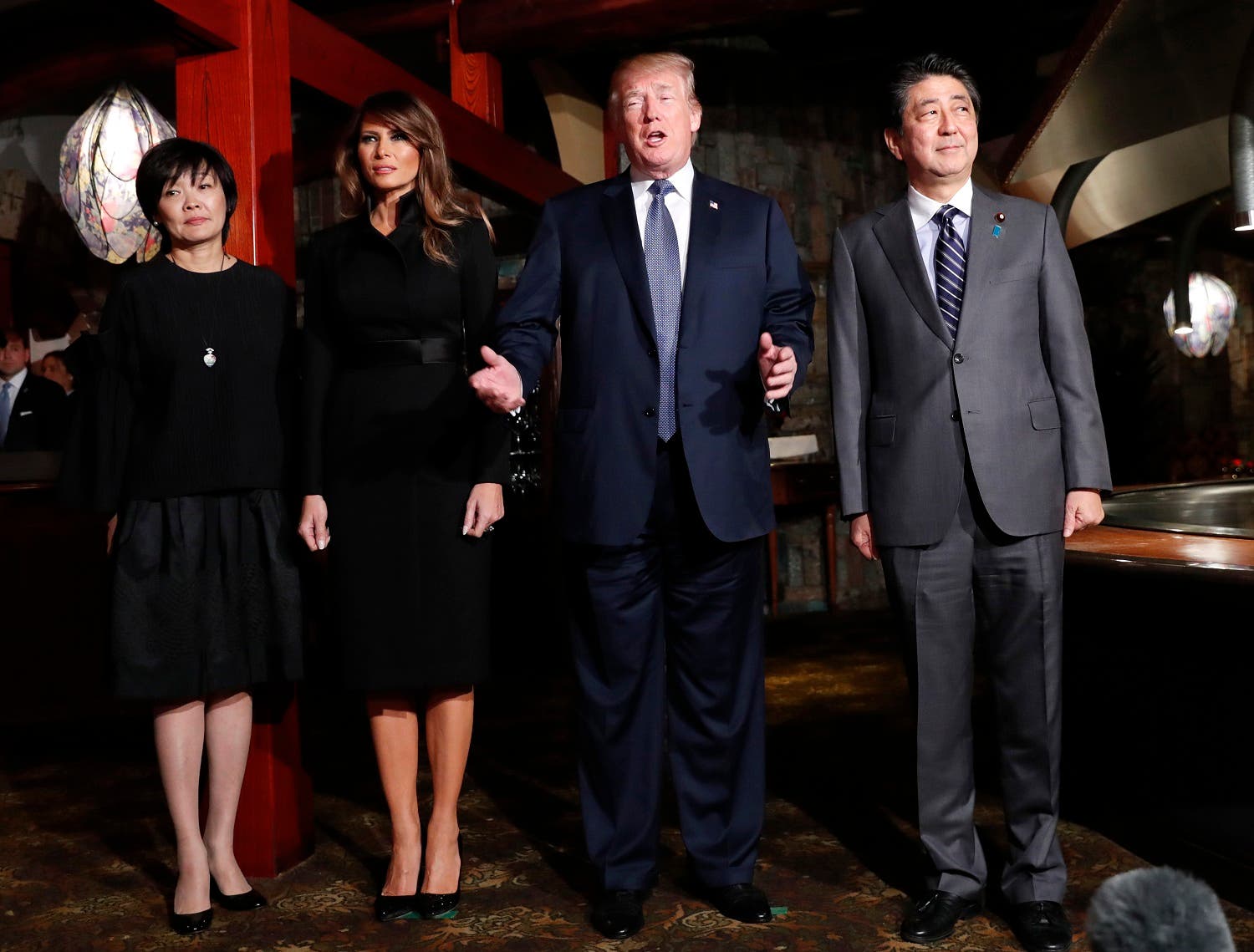 President Donald Trump, accompanied by first lady Melania Trump, , Japanese Prime Minister Shinzo Abe and his wife Akie Abe, speaks to members of the media before having a dinner at Ginza Ukai Tei restaurant, on Nov. 5, 2017, in Tokyo. (AP)