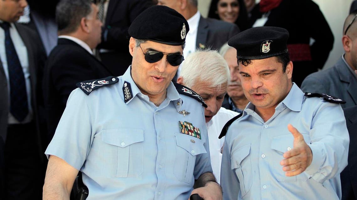 Palestinian police commander in the West Bank, Hazem Atallah (L), arrives at the Independence University, a security academy that trains police and security forces officers, to attend the inauguration ceremony of a mosque and a new part of the campus on May 1, 2015 in the town of Jericho. AFP PHOTO / AHMAD GHARABLI AHMAD GHARABLI / AFP